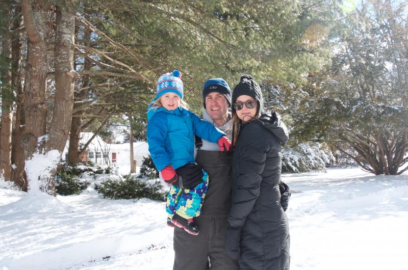 Emily, Dave and Whitney Rolfs of Mattapoisett put on their snow suits and headed outside. The family planned to blow up tubes and go sledding on a hill nearby. BY GEORGIA SPARLING